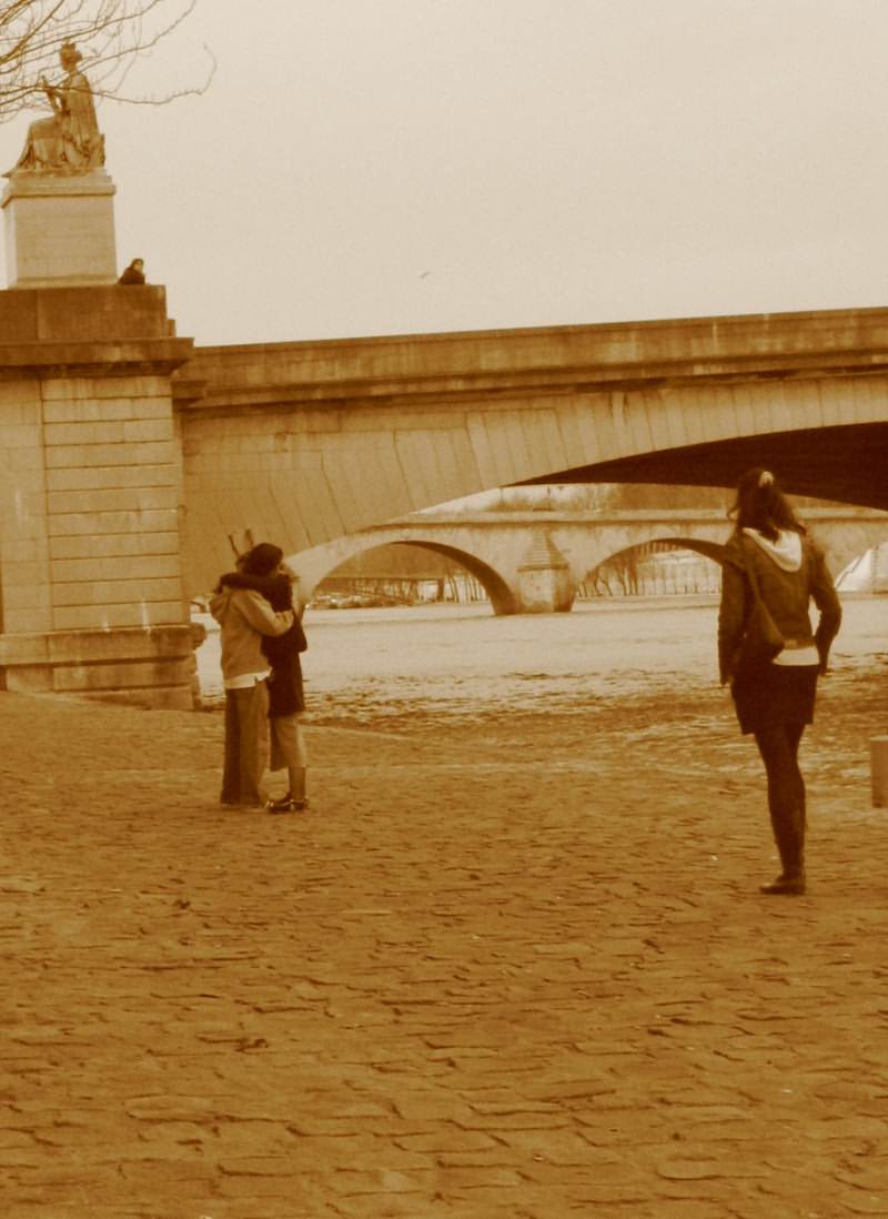 Paris City Photo - Sepia - A couple in love and a single girl on Les Quais de la Seine