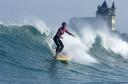 Girl surf big wave