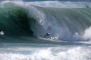 Kelly Slater surfing big wave
